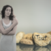 collage with stones with a text saying trust, and a female giving herself a hug.